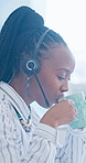 Drinking, coffee and woman with headset, call center and happy with warm beverage and contemplating. Business, consultant and black person with hot tea on break, thinking and consultation services