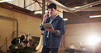 Carpenter, phone call and tablet with man in workshop for planning, digital schedule or timetable. Communication, warehouse and app with person and flare in factory for online agenda or inventory