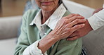 Caregiver, holding hands and old woman at house for comfort, empathy and medical diagnosis. Nurse, consoling and senior person in lounge for support, understanding and assisted living for healthcare