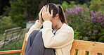 Nurse, mental health and woman with burnout, outdoor and regret for healthcare mistake or overworked. Unhappy, caregiver and person with depression at park, thinking and contemplating with anxiety