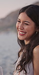 Woman, laugh and couple at beach with sunset, wine glass and funny conversation for summer holiday. Evening, happy person and partner talk outdoor with alcohol drink, humor and romantic vacation.