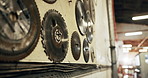 Wall, saw and blades in workshop for carpentry, woodworking and collection for production. Equipment, cutting and tools in workplace for joinery, spare parts and storage for manufacturing furniture