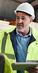 Man, engineer and tablet in workshop for discussion, team duties or app for work schedule. Mature project manager, tech or meeting in factory for efficient production, manufacturing timetable or talk