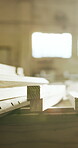 Woodworking, factory and lumber stack on table, manufacturing and material for furniture production. Carpentry, process and custom timber for architectural project, restoration and craftsmanship