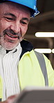 Man, engineer and tablet in workshop with typing, stock order or app for work timetable. Mature project manager, tech or reading in factory for efficient production with smile for ahead of schedule