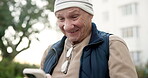 Text, smile and old man outdoor with phone, online communication and post reaction on social media. Digital, happy and senior person with laugh, message update and chatting on virtual platform.