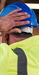 Construction, helmet and man on site with inspection, risk control and safety in building project. PPE, back or mature engineer with hardhat, hazard prevention or compliance in industrial evaluation.