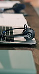 Empty, office and mic at call center with laptop, contact us and customer service for crm. Help desk, headset and online in workplace with pc, virtual assistance and telecom advisory for tech support