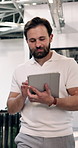 Tablet, walking and businessman in office with research for finance report with revenue growth. Digital technology, professional and financial manager with reading for investment profit in workplace.
