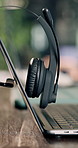 Empty, office and headset at call center with laptop, contact us and customer service for crm. Help desk, mic and online in workplace with pc, virtual assistance and telecom advisory for tech support