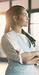 Business, woman and thinking with confidence in office for vision, reflection or ambition. Thoughtful, female person or employee contemplating with flare or arms crossed for job opportunity or dream