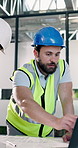 Contractor, laptop and team discussion with man for construction project or development blueprint. Computer, architect or planning with schematic for building design, strategy or office collaboration