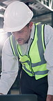 Contractor, laptop and talking with man for construction project, renovation or development. Mature person, architect or planning with computer for building design, maintenance or schedule in office
