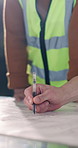 Contractor, hands and team discussion with blueprint, construction guide or development layout. Document, architect or people writing on schematic for building design, floor plan or drawing in office