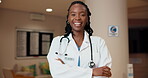 Black woman, doctor and face in healthcare with arms crossed, integrity and happy for night service. Cardiologist, smile and confident in hospital for about us, wellness representative and overtime