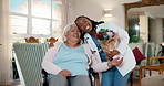 Hug, doctor and old woman in wheelchair with flowers, present or homecare visit for support. Medical worker, bouquet and happy person with disability, thanks or gift with floral scent in retirement