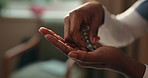 Nurse, hands and pills in clinic for wellness, patient care and supplements for health improvement. Healthcare, worker or person in hospital with drugs, prescription or medicine for medical treatment