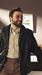 Fashion designer, celebration and man with smile in office, talking and employee with vintage style. Retro, stylist and happy person with good news, discussion and cheering for design achievement