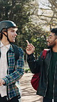 Walking, men and students in nature with conversation, talking or bonding at university campus. Electric scooter, fist bump and friends outdoor in park for commuting to college for education support.
