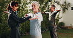 Senior woman, stretching and personal trainer in backyard, fitness and exercise routine for wellness. Outdoor, instructor and workout with mature people, warm up and physical activity at house