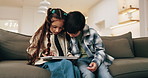 Children, siblings and tablet in house to play game, learning and bonding together on weekend. Kids, tech and relax on sofa for educational gaming, puzzle app and click for online development