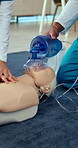 CPR, hands or nurses training with dummy for healthcare, first aid practice or emergency rescue. Medical students, life saving and people with mannequin in ventilator mask for learning at clinic