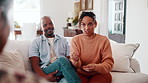 Argument, frustration and couple on sofa for therapy with accusation of cheating, infidelity or affair. Angry, fighting and man with woman at counseling session for conflict resolution in marriage.