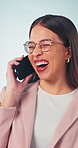 Businesswoman, surprise and laugh in studio with phone call, joke and funny news for public relations. Happy, person or PR agent with tech, contact or humor for shocking discussion on blue background