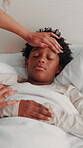Mother, child and care in home with sickness, check temperature and support in bedroom. Parent, boy and touch forehead in bed to monitor health, flu symptoms and childcare with rest for virus