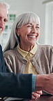 Senior couple, handshake and happy with financial advisor, agreement and checking savings on tablet. Old people, online and reading investment report, shaking hands and laugh with technology in house