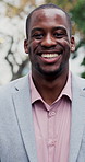 Happy, black man and face of lawyer in city with confidence for legal career growth outdoor. Smile, about us and portrait of environmental attorney with pride for sustainable law case in urban town.