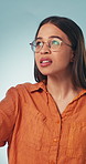 Mistake, stress and woman with hand on head in studio for wrong, choice or fail with opinion. Oops, emoji and female person frustrated by bad decision, review or fake news risk on blue background