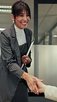 Team, handshake and woman with documents in office, talk or planning for case with legal information. Attorney, collaboration and mature person with paperwork, shaking hands and meeting in law firm