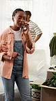 Phone call, moving and woman in home with stress, problem or delay for relocation service. Talking, couple and African person on cellphone for update, help or info for furniture delivery in new house