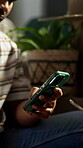 Scroll, phone and hand in house with connection, online chat and post update on social media. Digital, browsing and man in home with tech, app notification or internet research on virtual platform.