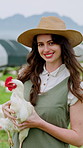 Farmer, face and happy woman with chicken on poultry farm for livestock or agriculture in nature. Portrait, female person or agriculturist with smile, hen or animal for food production or growth