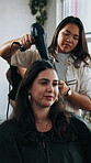 Blow dry, brush and hairdresser with customer in salon for change, hair maintenance or service. Hairdryer, happy and styling with women in hairdressing workplace for haircare process or treatment