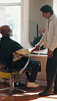 Barbershop, man and shaking hands with client for service, customer satisfaction and thank you. Mature person, smile and handshake with barber for grooming results, transformation and beard care