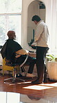 Man, customer and barber at salon with tablet, research and haircut inspiration for maintenance. People, talking and stylist with digital for beauty, grooming options and pricing service for haircare