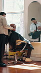Process, haircare or old man in barbershop with cover, grooming prep or hair service in appointment. Mirror, senior client or stylist with apron, salon consultation or beard trim in wellness routine.