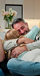 Smile, father and children at house with hug, love and parental care for bonding together. Excited, mature man and embrace in living room with kids, affection and family connection for weekend break