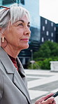 Phone, thinking and businesswoman in city with ideas, planning or decision on finance career. Technology, professional and mature financial manager with cellphone for email feedback in urban town.