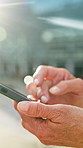 Person, hands or scrolling with phone in city for social media, communication or outdoor connection. User, browsing or research with smartphone for mobile app, internet or network in an urban town