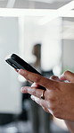 Woman, hands and typing in office with phone, company email and online for text message notification. Coworking, person and tech in business with website, mobile chat or download application for work