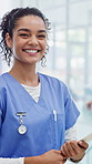 Nurse, face and happy woman with pride in hospital for medical help or healthcare service. Portrait, female person or doctor with smile or documents for health advice, assistance or care in clinic