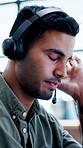 Headache, headset and thinking with man in call center for assistance, consulting or feedback. Communication, customer service and stress with frustrated agent in office for review or support