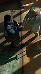 Above, handshake and meeting with business men in hotel lobby for collaboration or welcome. B2B, hospitality and thank you with employee people shaking hands in foyer for accommodation or travel