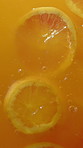 Orange, health and juice splash for wellness, diet or nutrition with natural benefits from above. Organic, vitamin c and fruit beverage with fresh citrus for liquid detox, production or hydration.