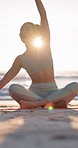 Yoga, beach and woman stretching on exercise mat for fitness, sunshine and wellness outdoor in nature. Happy person, talking and morning routine by ocean for mindfulness, self care and peace 