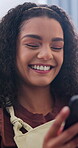Laugh, typing and woman in house with phone, online communication and comic post on social media. Happy, texting and person in lounge with technology, funny message and meme reaction on chat app.